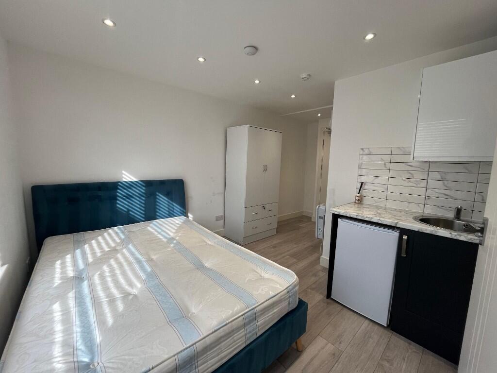 Bright, modern bedroom with a comfortable doubl...