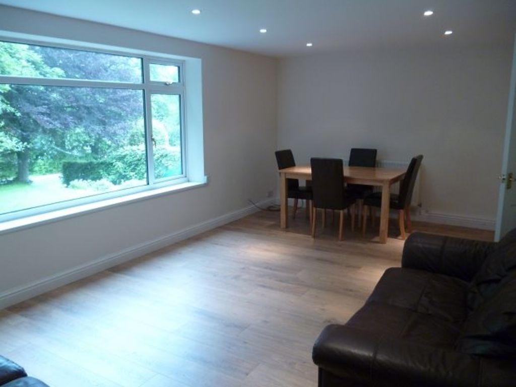 Bright, modern living room with a large front w...