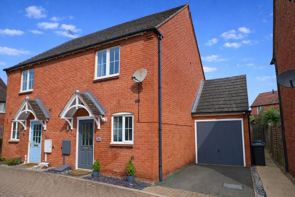 Semi-detached houses and garage in daylight.png