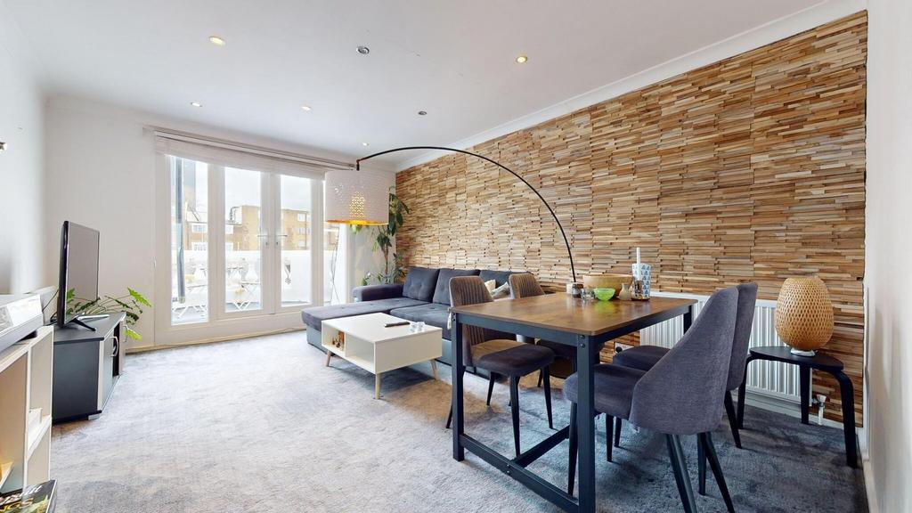 Bright, modern living area with large floor-to-...