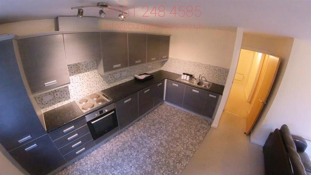 Modern galley kitchen with integrated oven, sle...