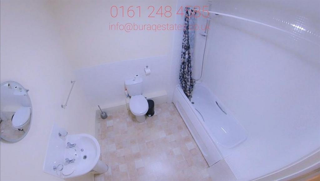 Bright, clean bathroom with a full-sized bathtu...