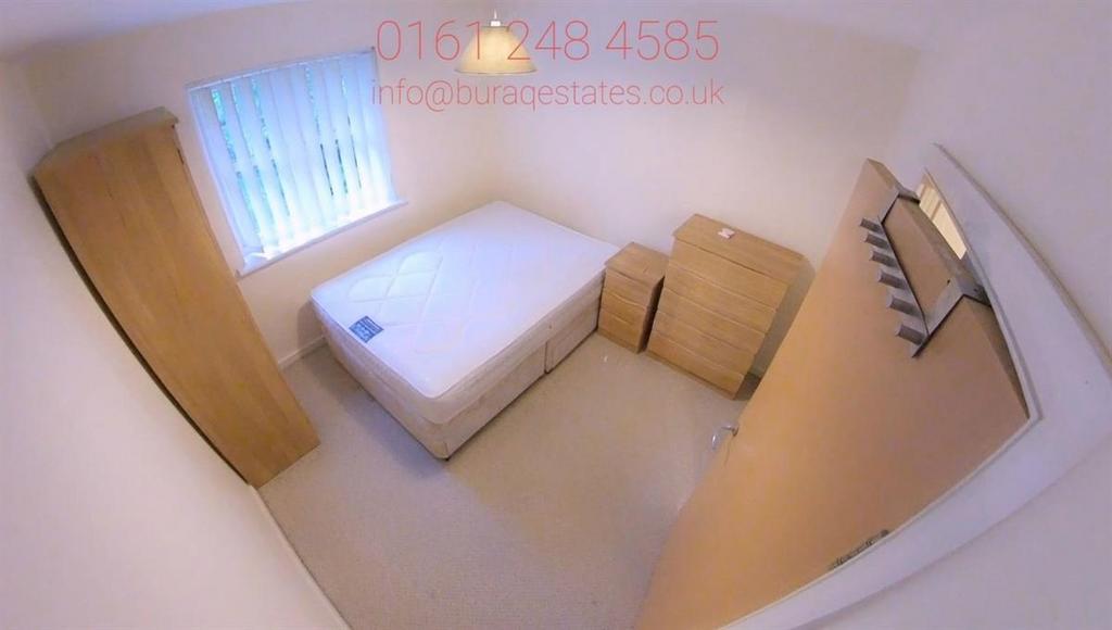 Neat, simply furnished bedroom with a single be...