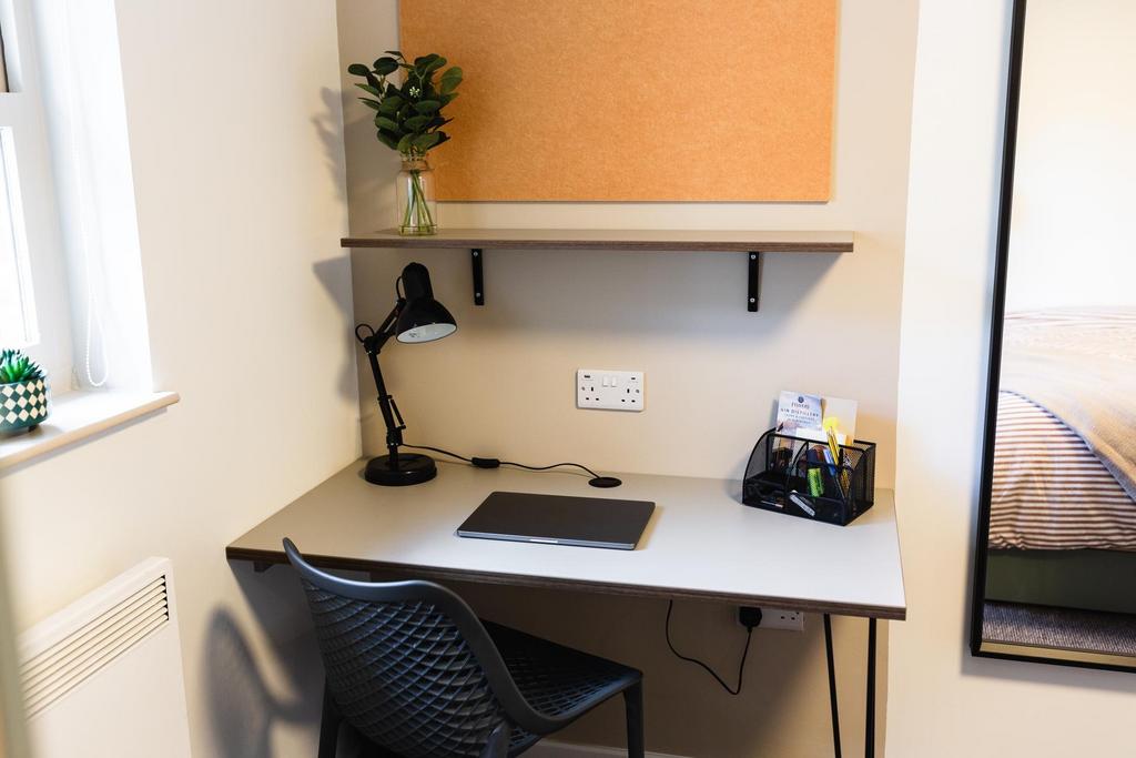 Bright, tidy study nook with a modern desk, tas...