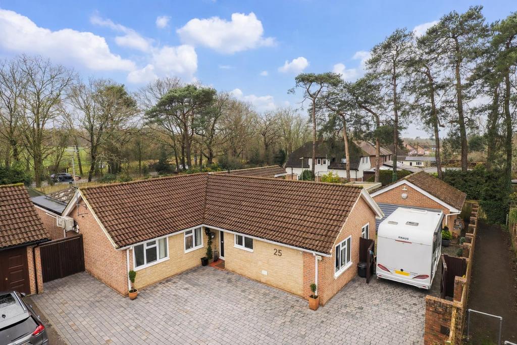 Bungalow with caravan and driveway - clean photo .