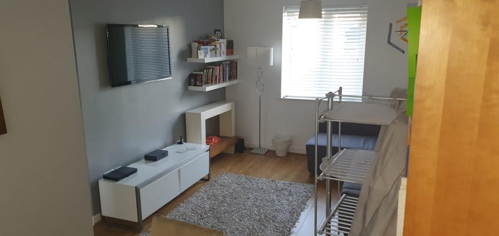 Well-presented living room with a wall-mounted ...