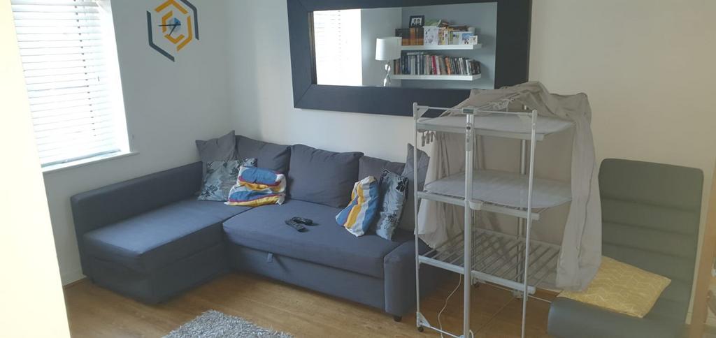 Bright, modern living area with a comfortable g...