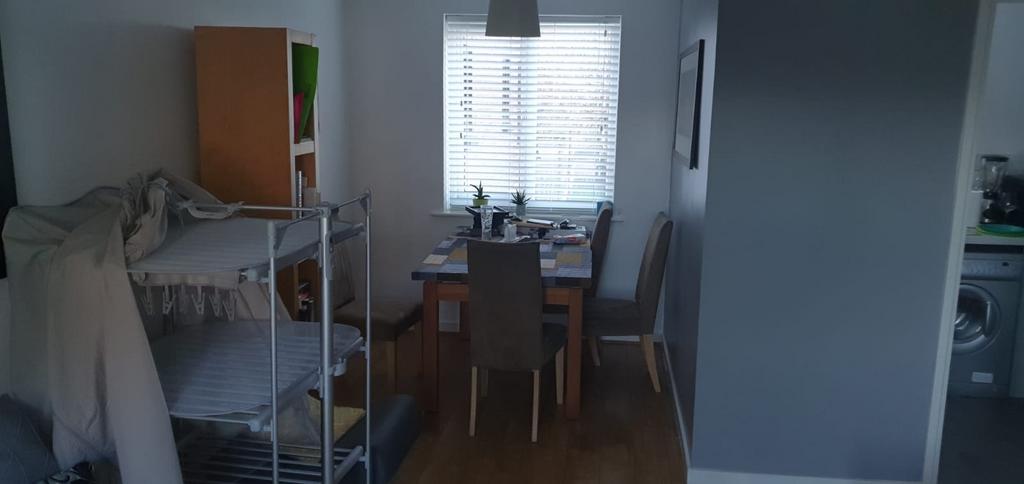 Bright eat-in kitchen area with a window offeri...