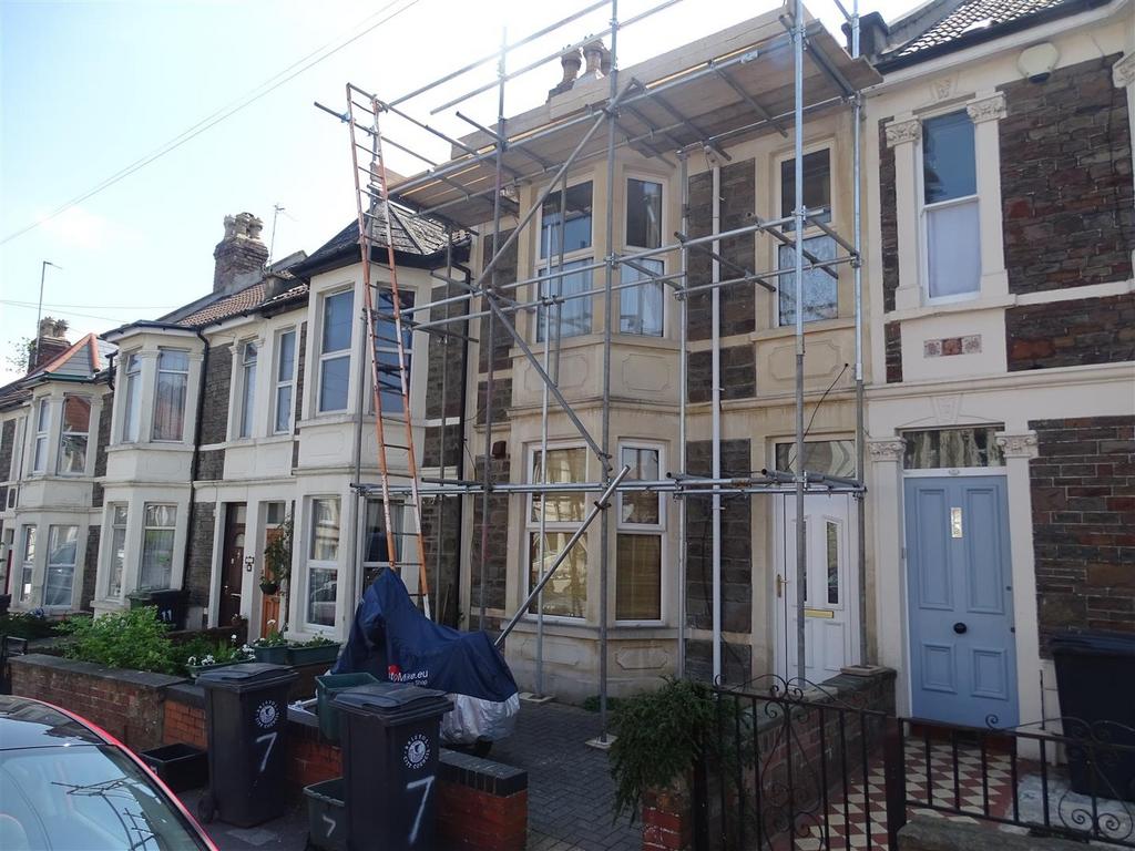 Terraced two-storey house frontage with bay win...