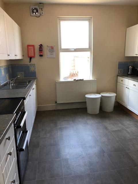 Bright, practical kitchen with plenty of floor ...