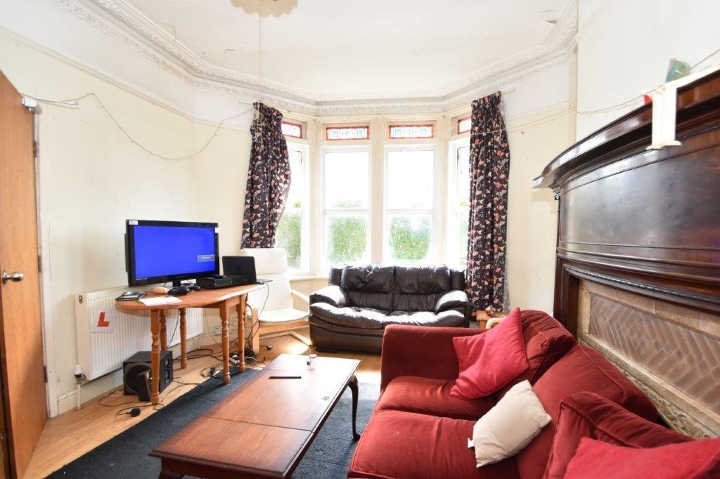 Bright, welcoming living room with a bay window...