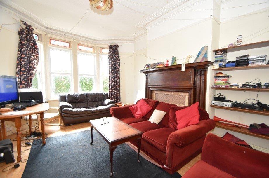 Bright, well-appointed living room with a large...
