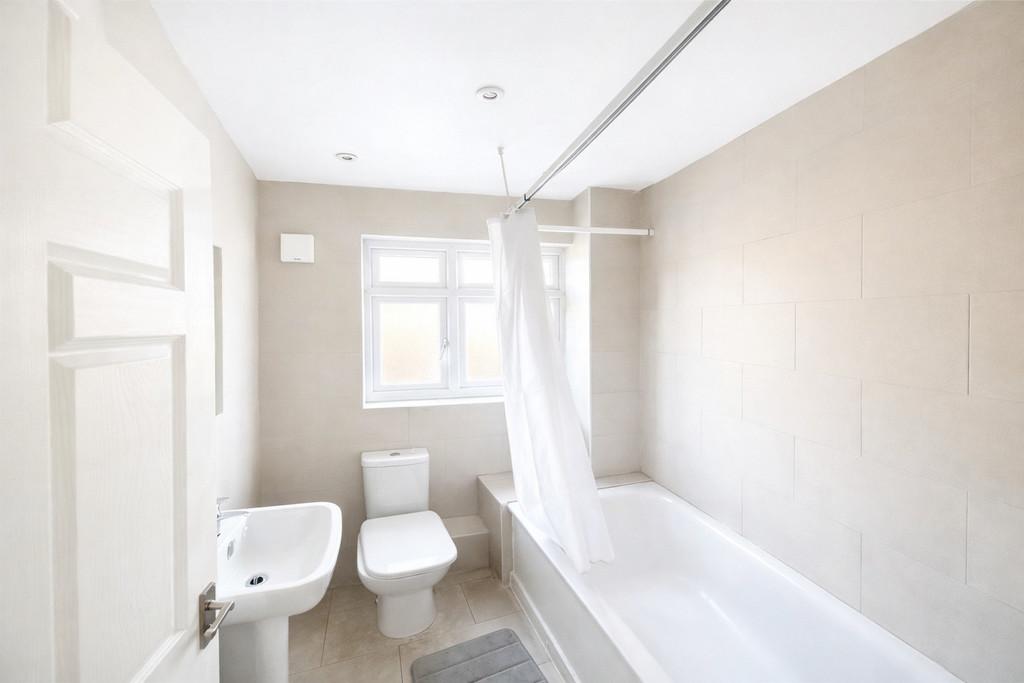 Compact neutral-toned bathroom scene (1)