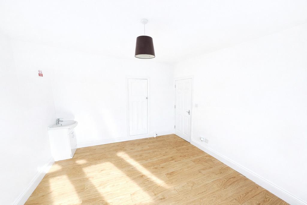 Bright room with white doors and sink