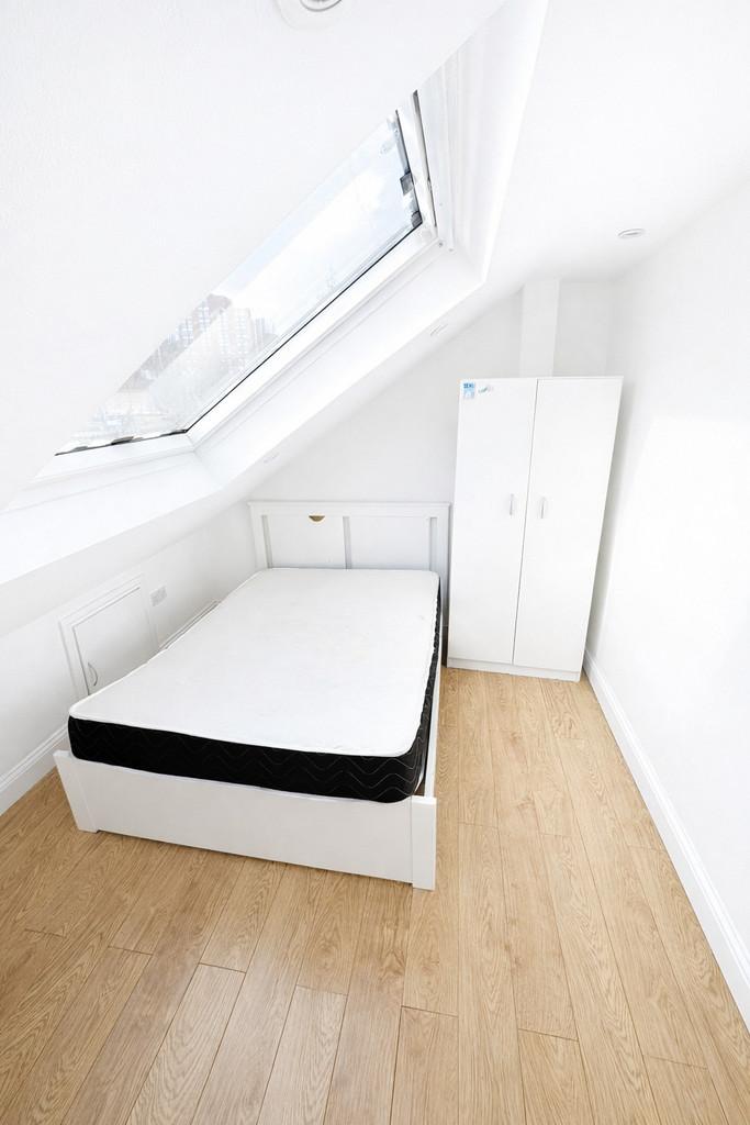 Bright attic bedroom with skylight