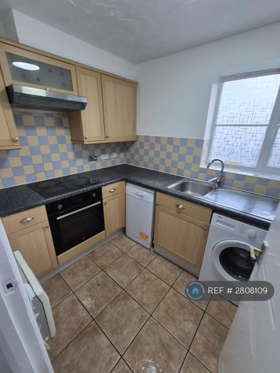 Kitchen With Washing Machine And Dishwasher