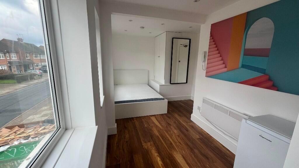Bright single bedroom with a large front-facing...