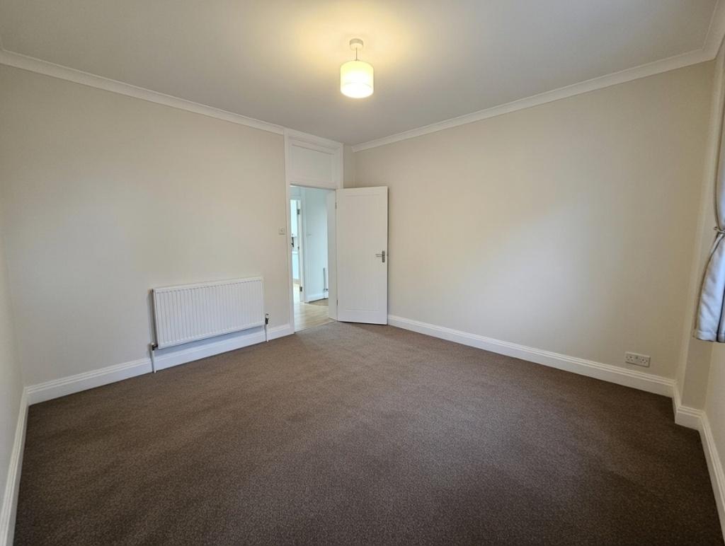 Bright, neutral double bedroom with fresh paint...
