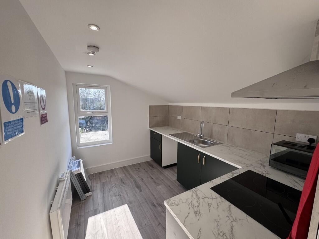 Bright, modern kitchen with fitted units, integ...