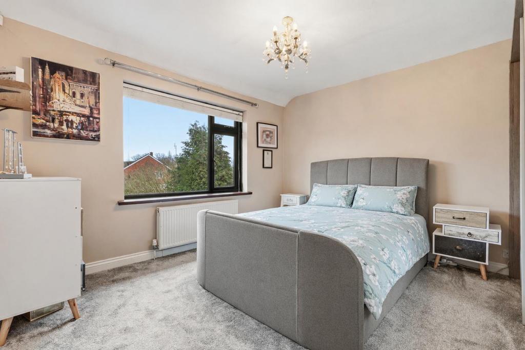 Elegant bedroom with soft pastel accents.png