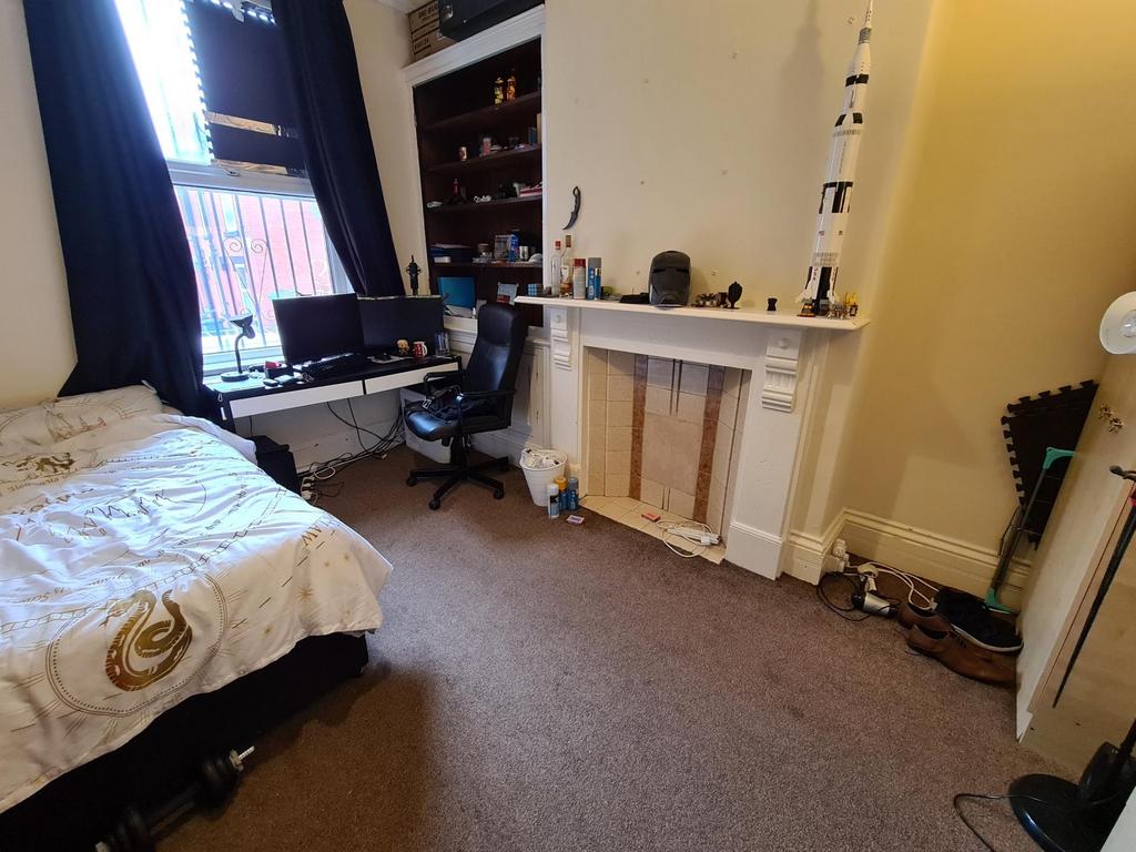 Bright furnished bedroom with a double bed, wor...