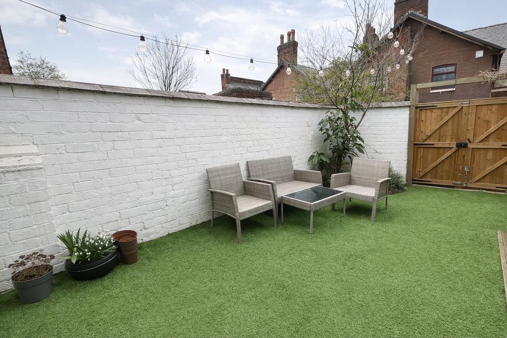Private paved garden with artificial turf, tidy...