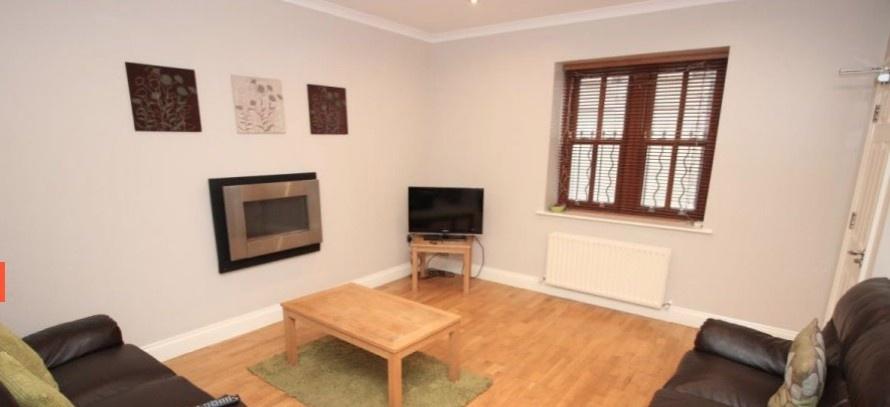 Bright, well-presented living room with wooden ...