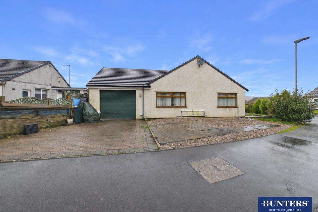 Detached house with green garage door.png
