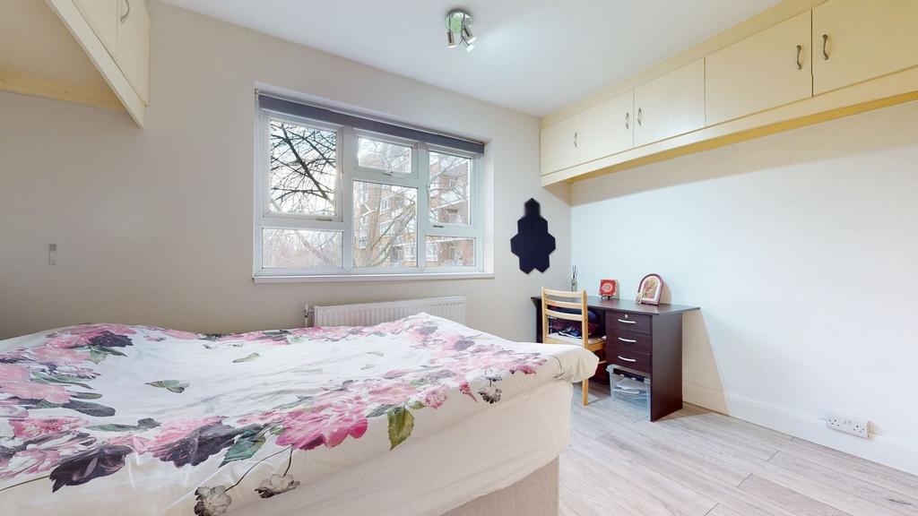 Bright, neatly presented bedroom with a large w...