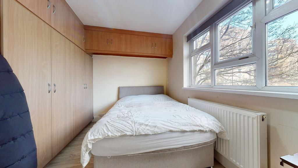 Bright furnished double bedroom with a comforta...