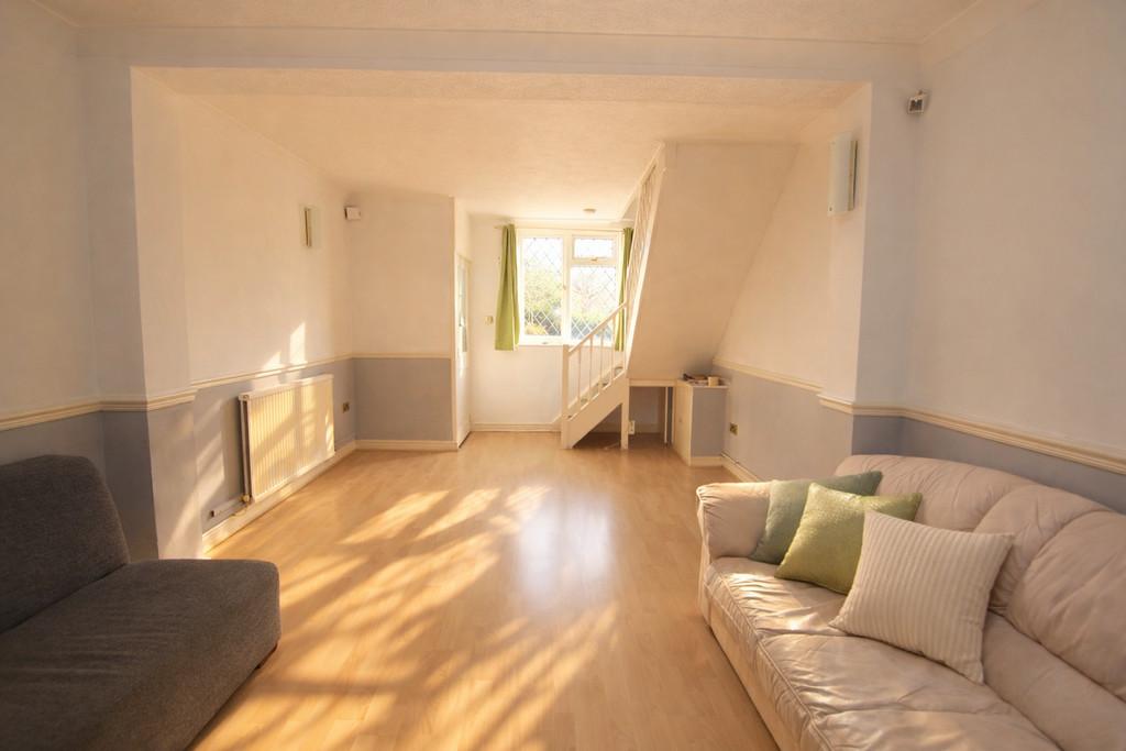 Sunlit living room with cozy seating