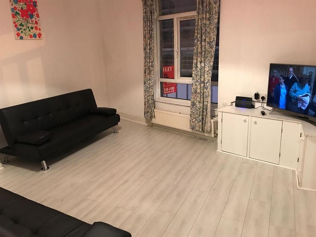 Bright, modern living room with light wood-effe...
