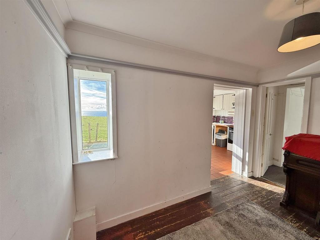 Dining area to kitchen and snug