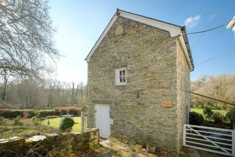 undefined, 'Four-acre riverside smallholding with private fishing rights and income potential'