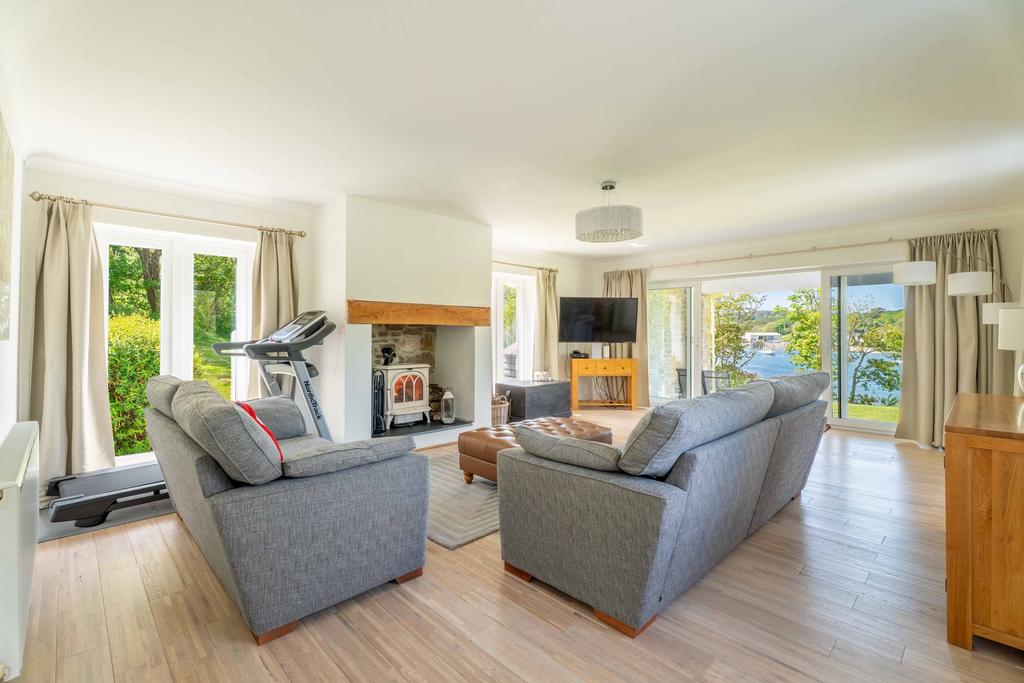 Living Room with Log Burner and Doors leading...