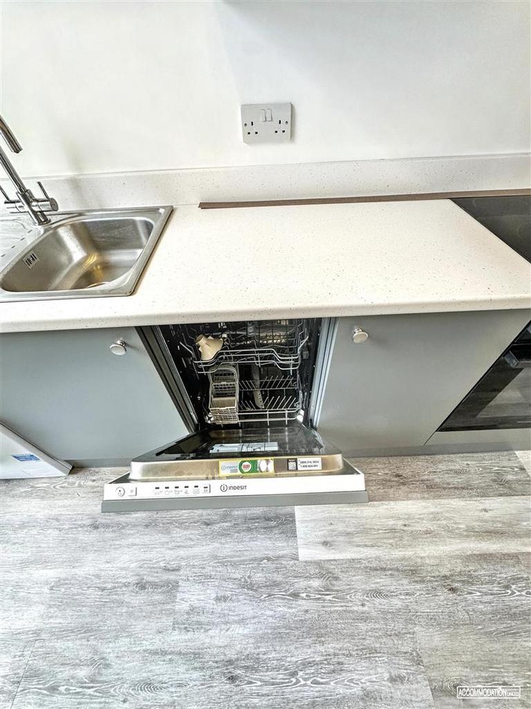 Modern kitchenette with integrated dishwasher, ...