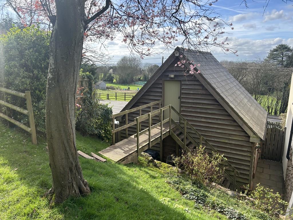 Garden showing Garage and view