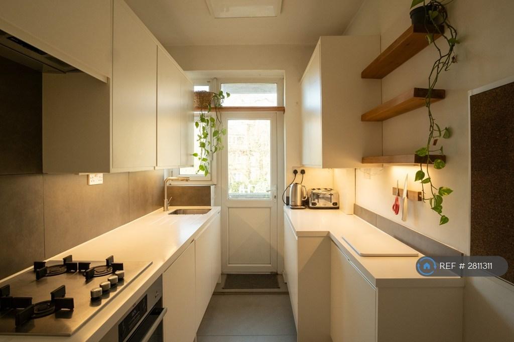Kitchen Leads To Second Balcony With Veg Planters