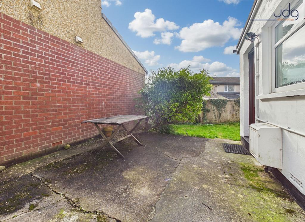 Private rear seating area and lawn