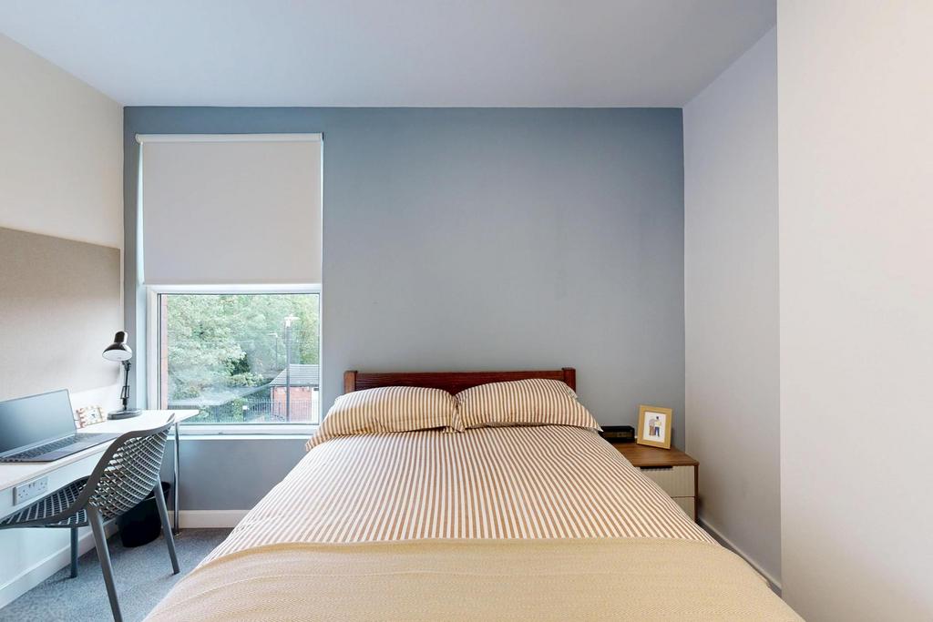 A spacious and well-maintained master bedroom f...
