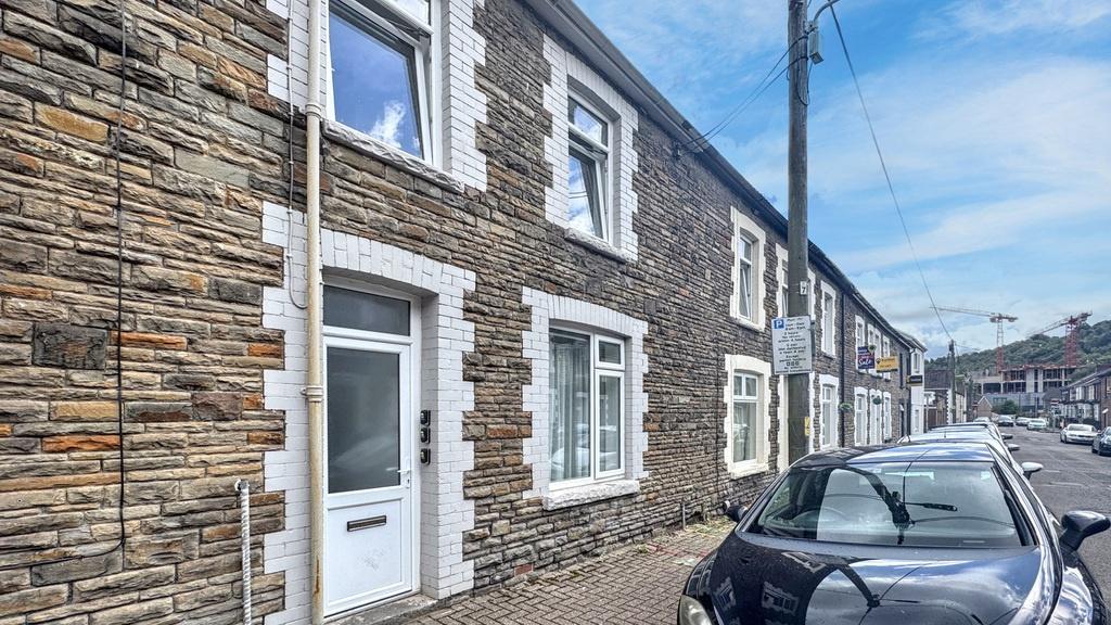 Traditional stone-fronted terraced house with w...