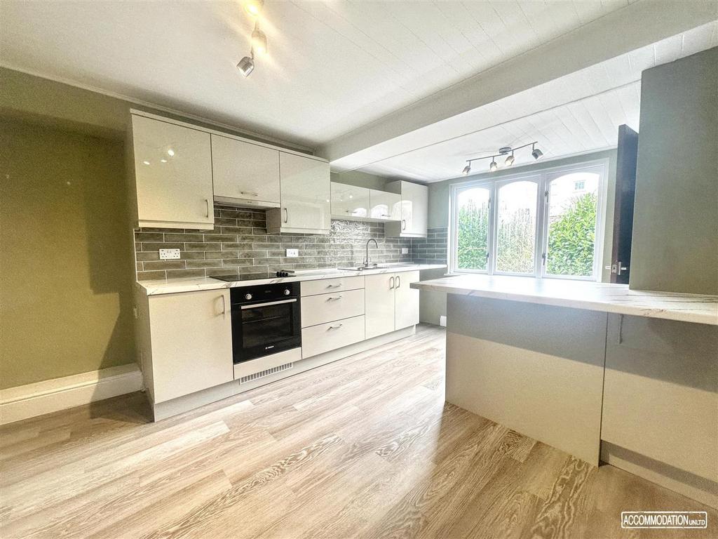 Bright modern kitchen with breakfast bar...