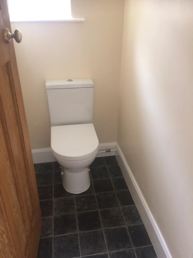 Compact and tidy WC with a modern close-coupled...