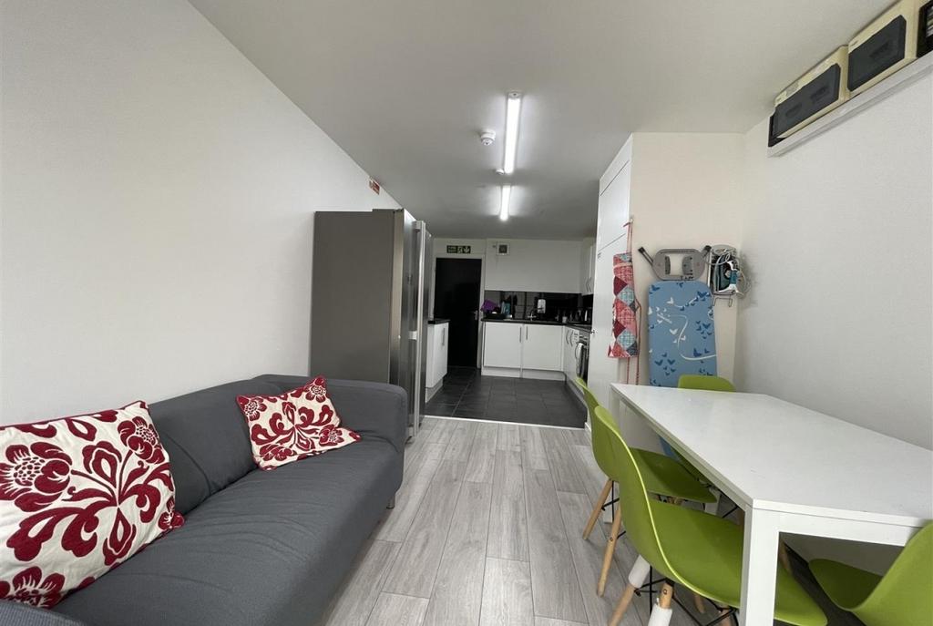 Contemporary open-plan living area with a comfo...