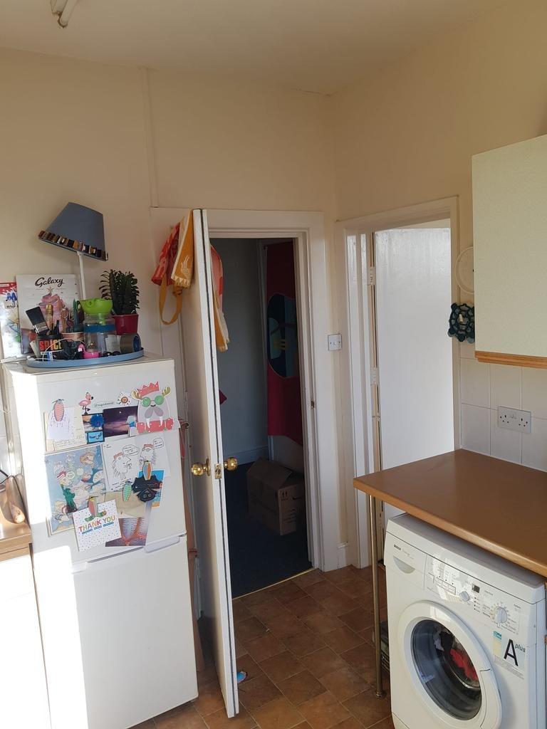 Bright, functional kitchen area with a freestan...