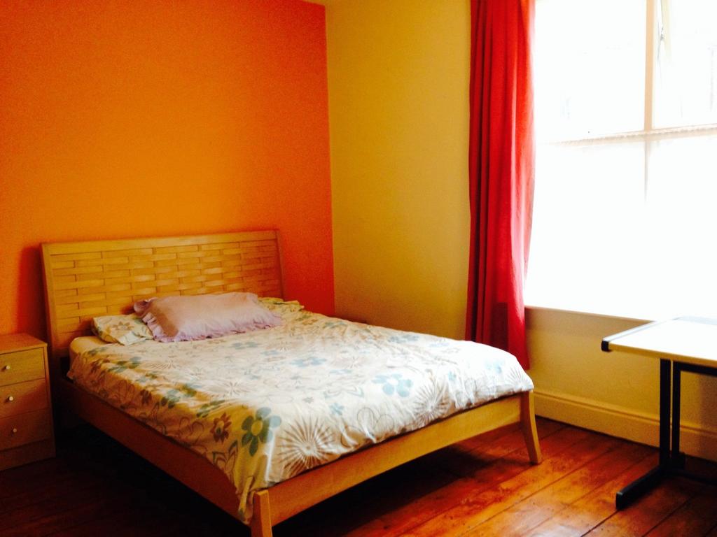 Bright and welcoming master bedroom featuring w...