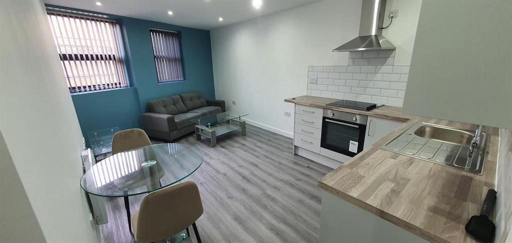 Bright open-plan living area with a modern kitc...