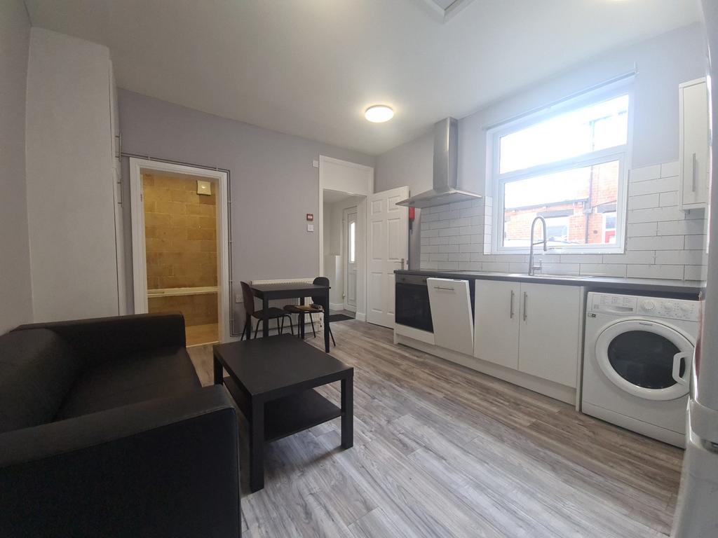 Bright fitted kitchen with seating area...