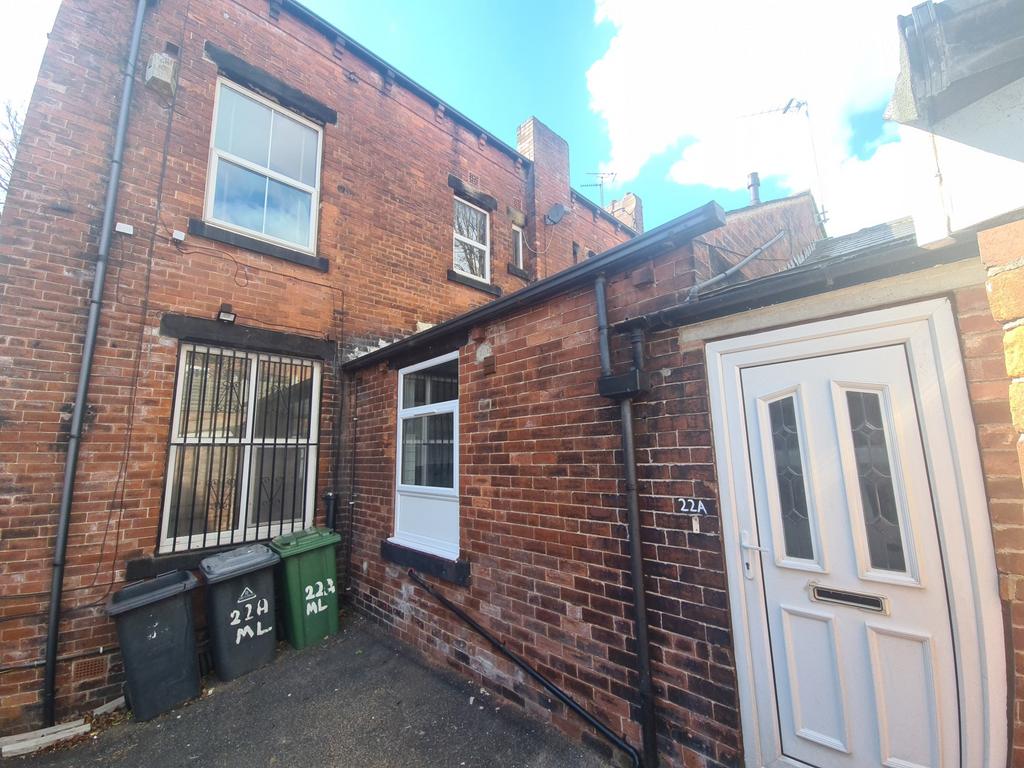 Rear of brick property with secure entrance...