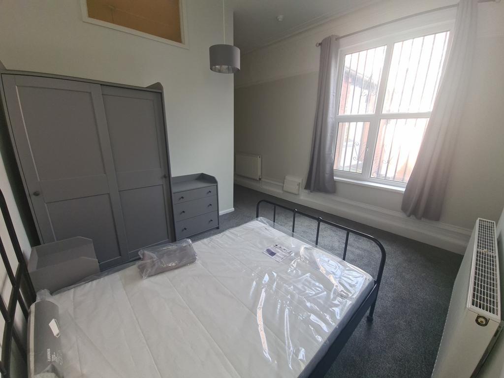 Bright bedroom with wardrobe and desk...